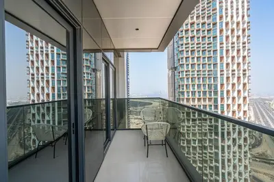 a balcony with a table and chairs in a building at Relaxing 2BR in Business Bay Mins to Burj Khalifa in Dubai