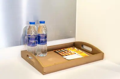 a wooden box with two bottles of water and matches at PVH - Dubai Mall Access 1BR - Emaar Fashion Avenue in Dubai