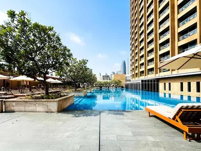 a swimming pool in the middle of a building at PVH - Dubai Mall Access 1BR - Emaar Fashion Avenue in Dubai