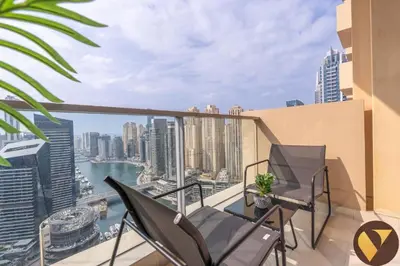 a balcony with a view of the city at Vogue Marina JW Marriott with Direct Access to Marina Mall, Studio Apartment with Balcony and Marina Skyline View, Access to all Amenities in Dubai