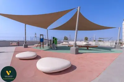 two white stools on a red rug under a tent at Vogue Al Maktoum City, District One Residence, within a short drive from Downtown Burj Khalifa and Dubai Mall, Three Bedroom Apartment plus Kids Room with Large Balcony in Dubai