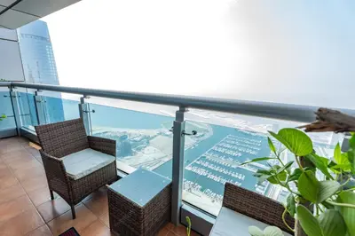 a balcony with chairs and a view of the city at 83rd Floor Luxurious Penthouse Full Sea View 6 BHK in Dubai