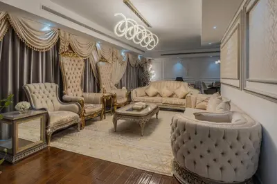 a living room with furniture and a chandelier at 83rd Floor Luxurious Penthouse Full Sea View 6 BHK in Dubai