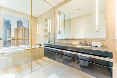 a bathroom with a sink and a mirror at Luxury 1BR with Breathtaking Dubai Water Canal Views, Just Beside Dubai Marina Mall and Tram, Near JBR Beach, The Address Residences, Dubai Marina by Deluxe Holiday Homes in Dubai