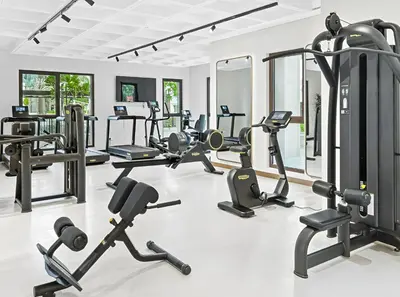 a gym with several treadmills and exercise bikes at Stylish 1BR with Balcony and Burj AlArab View in Dubai