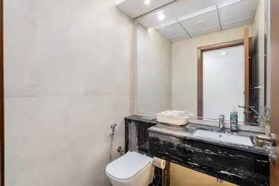a bathroom with a toilet and a sink at Elegant 2Bhk Panorama Apartment in Dubai