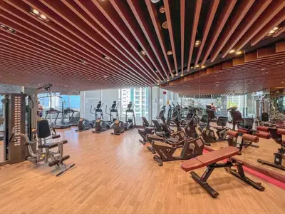 a gym with lots of exercise equipment in a building at Waves - Vibrant Studio, Perfect For Couples in Dubai