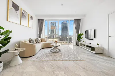 a living room with a couch and a large window at The Pad luxury 1BR with full Canal View in Dubai