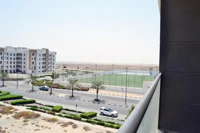 a view of a street from a balcony of a building at Cozy spacious Modern 1 bedroom Apartment in Dubai