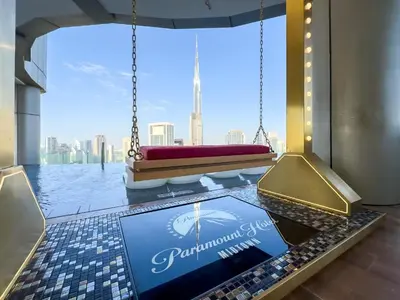 a room with a large window with a view of the city at Paramount Midtown - 1 Bedroom Apartment - Allsopp & Allsopp in Dubai