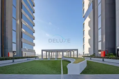 an architectural rendering of a courtyard between two buildings at Stay Near the Park with Easy Exit from JVC, Just Minutes to Dubai Marina and Palm Jumeirah - Bloom Towers A, JVC by Deluxe Holiday Homes in Dubai