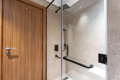 a shower with a glass door in a bathroom at Spacious 2BR Dubai Marina & City Views in Dubai