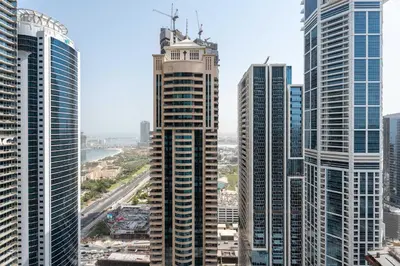 a group of tall buildings in a city at Spacious 2BR Dubai Marina & City Views in Dubai