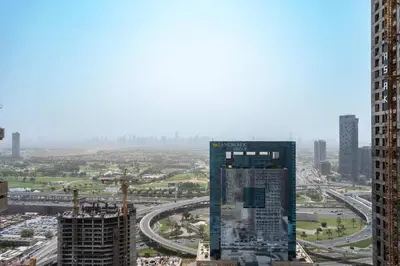 a view of a city with buildings and a highway at Spacious 2BR Dubai Marina & City Views in Dubai