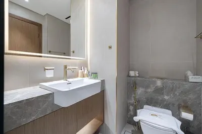 a bathroom with a sink and a toilet at PNB Living - Luxury Studio with Canal Views - Trillionaire Residences, Business Bay in Dubai