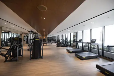 a gym with treadmills and ellipticals in a building at PNB Living - Luxury Studio with Canal Views - Trillionaire Residences, Business Bay in Dubai