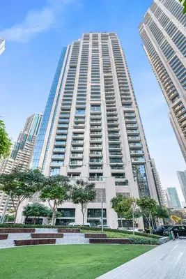 a tall building with a park in front of it at Act 2 - Luxury 2BR Facing Burj Khalifa & Fountain in Dubai