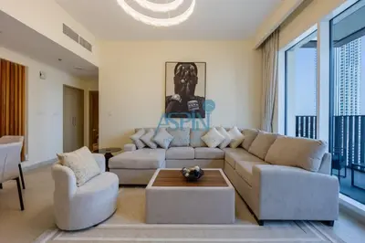 a living room with a couch and two chairs at Aspin 1BHK Waterfront View - Creek Horizon in Dubai