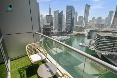 a balcony with a view of a river and a city at Stylish Stay at Bay Central with Skyline Views in Dubai