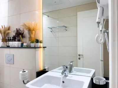 a bathroom with a sink and a mirror at 2 Bedroom Apt in Damac Capital Bay Tower A, Business Bay by Luxaura in Dubai
