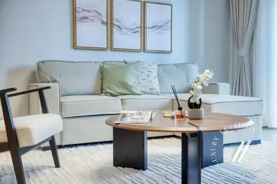 a living room with a couch and a coffee table at Luxury 1BR Harbour Views Tower 2 Creek Harbour Dubai in Dubai