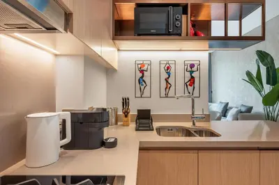 a kitchen with a sink and a microwave at Luxury-Brand New-Direct Access toThe Dubai Mall in Dubai