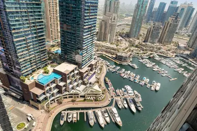 an aerial view of a marina with boats at 2BR In The World-Famous Twisted Skyscraper in Dubai