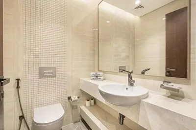 a bathroom with a sink and a toilet at Premium Central Home with Burj Khalifa View in Dubai