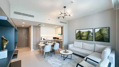 a living room with a couch and a table at Luxury Stay 1BR, Waterfront in Marina LIV Tower - 20AB05 in Dubai