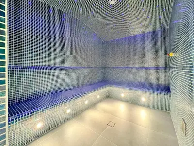 a sauna with purple lights in a room at Exclusive Marina Lifestyle with Stunning Views in Dubai
