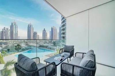 a balcony with a view of the city at Modern Waterfront Living with Stunning Views in Dubai