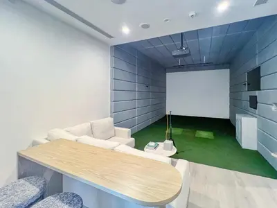 a meeting room with a table and a white board at Stylish Coastal Living with Premium Amenities in Dubai