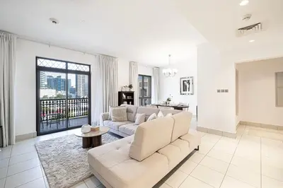 a living room with a couch and a table at Elegant 1-BR in Downtown Dubai's Old Town in Dubai