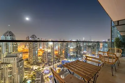 a balcony with a bench and a view of a city at FIRST CLASS 1BR Breathtaking Marina Views in Dubai