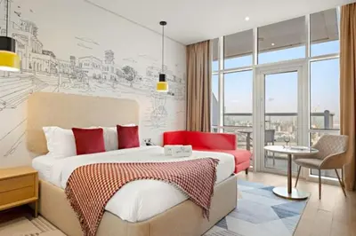 a bedroom with a bed and a room with a view at FIRST CLASS Studio Stylish , Prime Location in Dubai