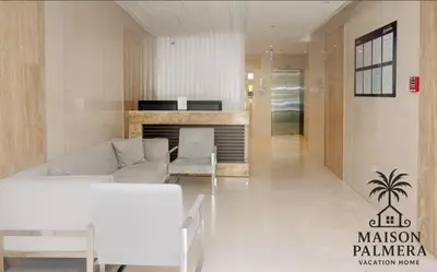 a living room with a couch and a fireplace at Park Vista-Infinity Pool View in Dubai