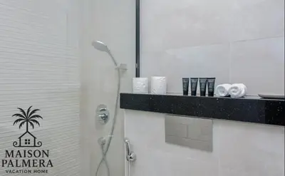 a shower in a bathroom with a black and white at Park Vista-Infinity Pool View in Dubai