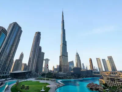 a view of a city with skyscrapers at Panoramic Burj 5br Condo with Full Led & Fountain View in Dubai