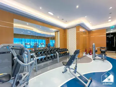 a fitness room with a gym with machines at Luxury Living Skyline Views l 2BR with Pool & Gym in Dubai