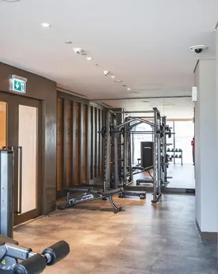 a gym with tread machines in a building at The Opera Grand Ultra Luxury Suite Burj Khalifa and Fountain View in Dubai