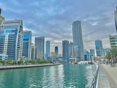 a river in a city with tall buildings at Comfort Ensuite with Balcony in Dubai