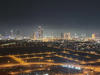 a view of a city at night with lights at City View Apartment very Close to Downtown and World Trade Center DIFC in Dubai