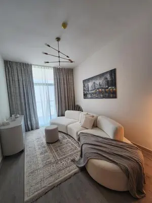 a living room with a white couch and a rug at City View Apartment very Close to Downtown and World Trade Center DIFC in Dubai