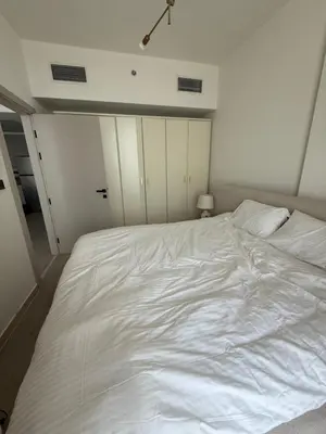 a large white bed in a white room at City View Apartment very Close to Downtown and World Trade Center DIFC in Dubai