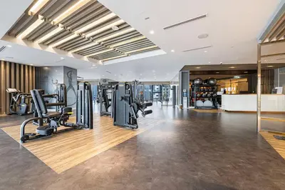 a gym with treadmills and ellipticals in a building at Amazing Burj Khalifa Views with Highest Infinity pool in Dubai