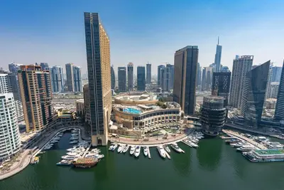 an aerial view of a city with boats in a harbor at Bright 1bhk Full Marina View in Dubai