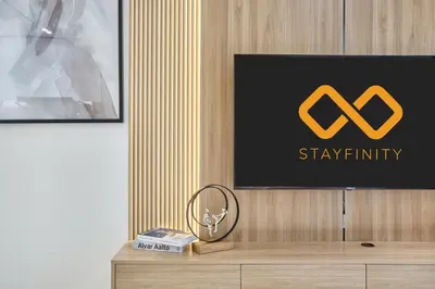 a sign on top of a dresser in a room at 1BR Apartment with Private Jacuzzi & Burj Khalifa Skyline in Trillionaire Residences By Binghatti in Dubai