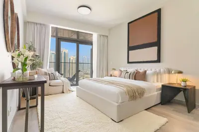 a bedroom with a white bed and a large window at Silkhaus Lavish 3BDR+Maid Room Imperial Avenue in Dubai