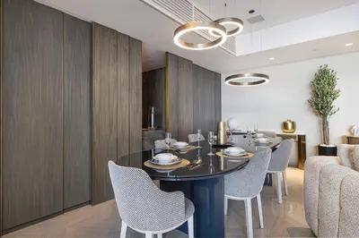 a dining room with a black table and chairs at Five Palm Jumeirah Luxury Apartment - 3BR in Dubai