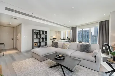 a living room with a couch and a table at BLVD - Direct Marina Walk - Eye of Dubai Fireworks - Iconic Marina Views with Rooftop Pool in Dubai